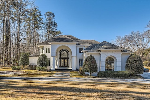 view of front of property featuring stucco siding and french doors