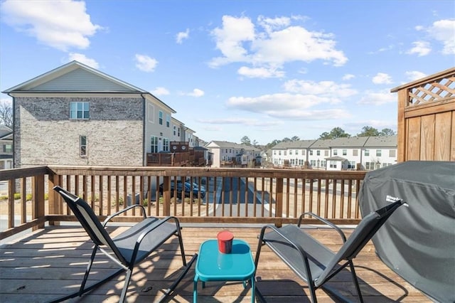 wooden deck featuring area for grilling