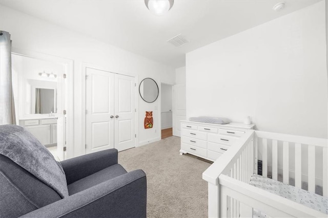 carpeted bedroom featuring a closet