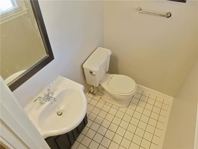 bathroom with tile patterned flooring, sink, and toilet