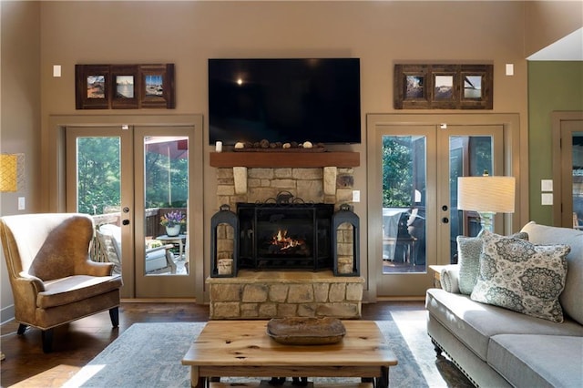 4 Bluff Ct, Cartersville, GA 30120 - living area with french doors, healthy amount of natural light, wood finished floors, and a fireplace