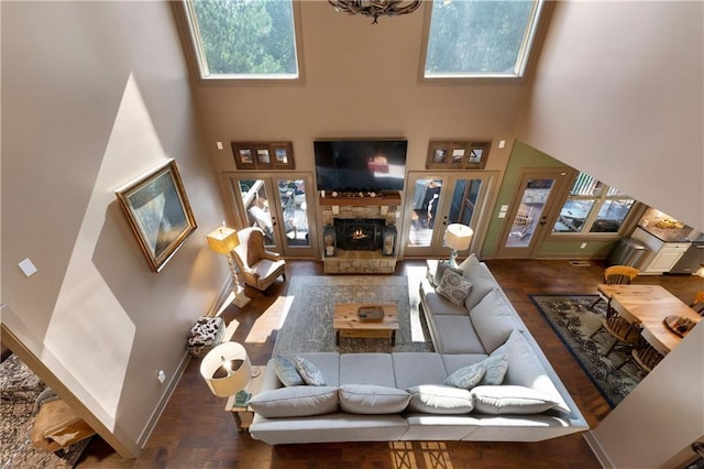 4 Bluff Ct, Cartersville, GA 30120 - living area featuring a high ceiling, wood finished floors, plenty of natural light, french doors, and a fireplace