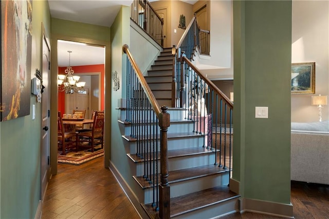 4 Bluff Ct, Cartersville, GA 30120 - staircase featuring wood-type flooring and a chandelier