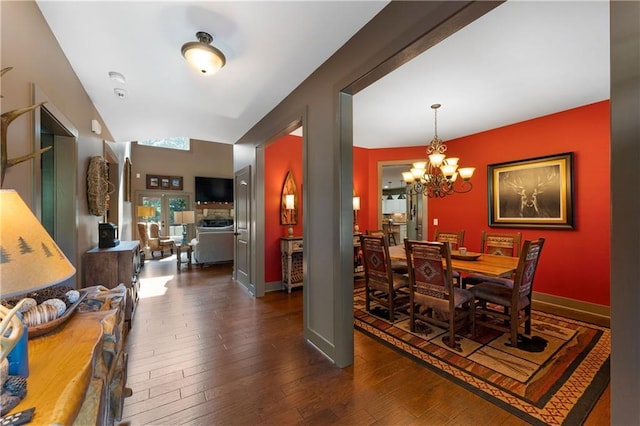 4 Bluff Ct, Cartersville, GA 30120 - dining space with a chandelier and dark wood-style flooring