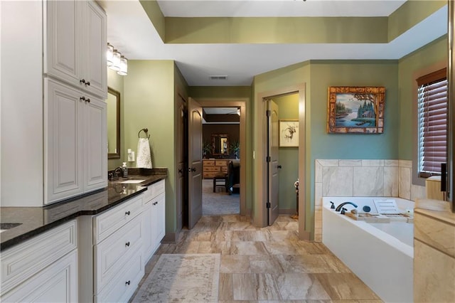 4 Bluff Ct, Cartersville, GA 30120 - bathroom featuring vanity and a bath