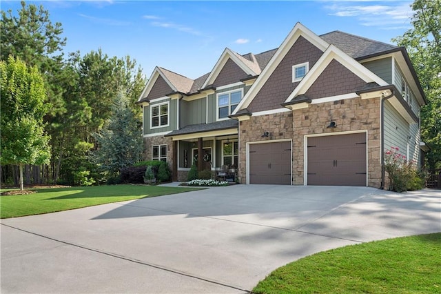 4 Bluff Ct, Cartersville, GA 30120 - craftsman inspired home featuring stone siding, concrete driveway, a front yard, and an attached garage
