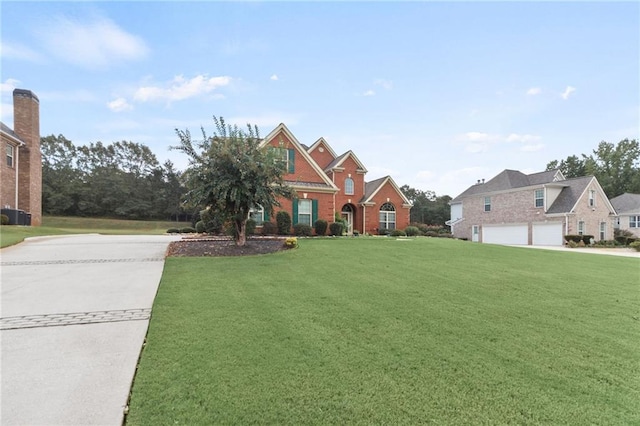 view of front of house with a garage, a front yard, and brick siding