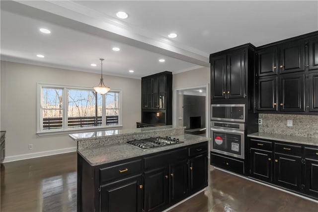 kitchen featuring backsplash, crown molding, dark cabinetry, and stainless steel gas stovetop