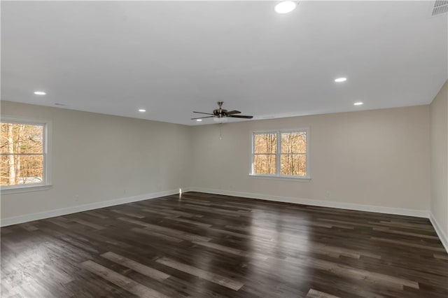 empty room with recessed lighting, baseboards, and plenty of natural light