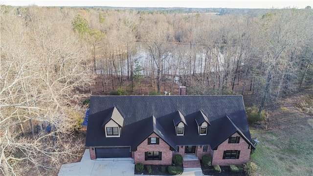 bird's eye view featuring a forest view