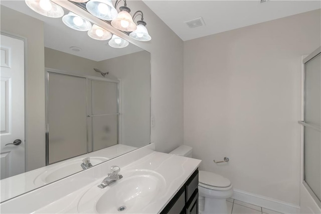 full bath with vanity, baseboards, tile patterned flooring, an enclosed shower, and toilet