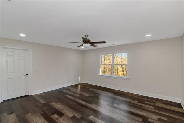 spare room with recessed lighting, a ceiling fan, dark wood-type flooring, and baseboards