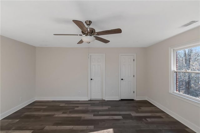 unfurnished bedroom with visible vents, baseboards, and wood finished floors