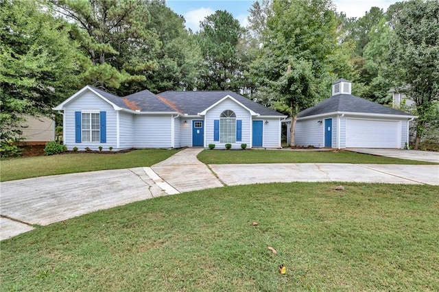 ranch-style home with a garage and a front lawn