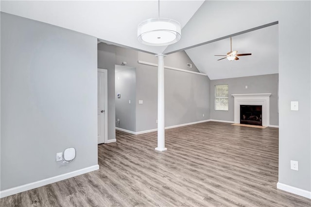 unfurnished living room featuring high vaulted ceiling, ceiling fan, and light hardwood / wood-style flooring