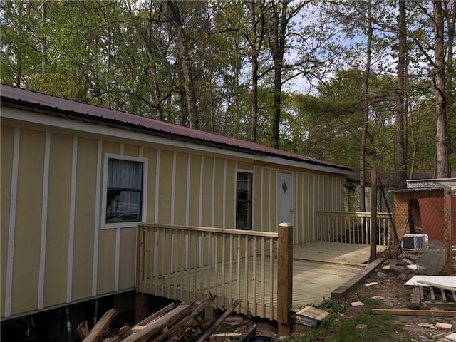 1747 Dawson Forest Rd, Dawsonville, GA 30534 - rear view of house with a deck, metal roof, and board and batten siding