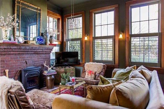 living room featuring a wood stove and ornamental molding