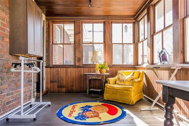 sunroom featuring wooden ceiling