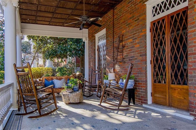 view of patio / terrace with an outdoor living space and ceiling fan