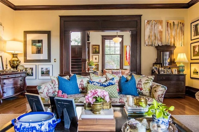 sitting room featuring wood finished floors and ornamental molding