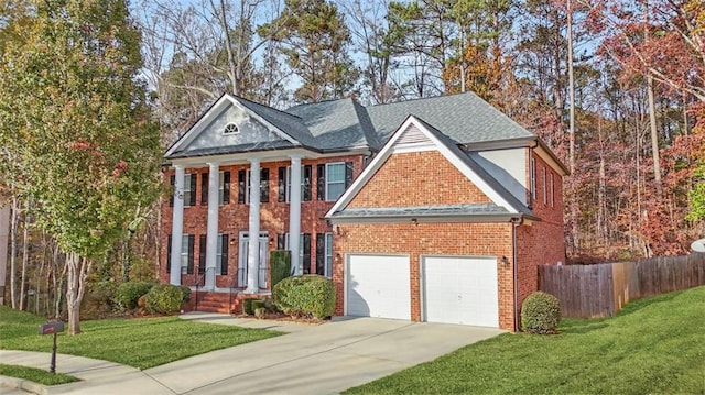 view of front of property featuring a front lawn and a garage