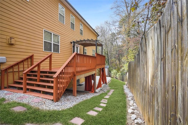 back of house featuring a wooden deck