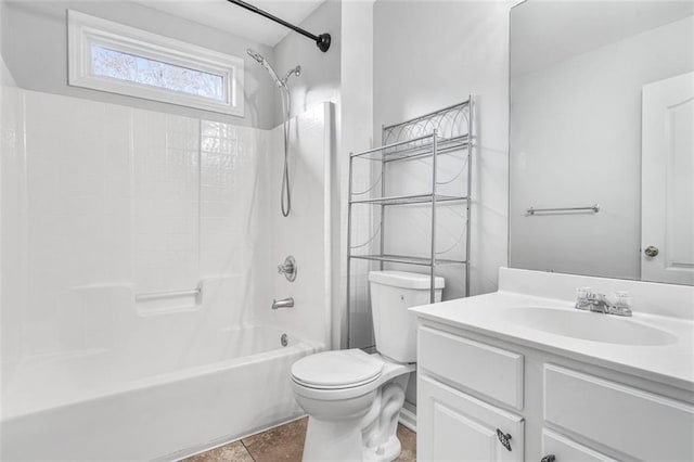 full bathroom featuring tile patterned floors, vanity, toilet, and washtub / shower combination