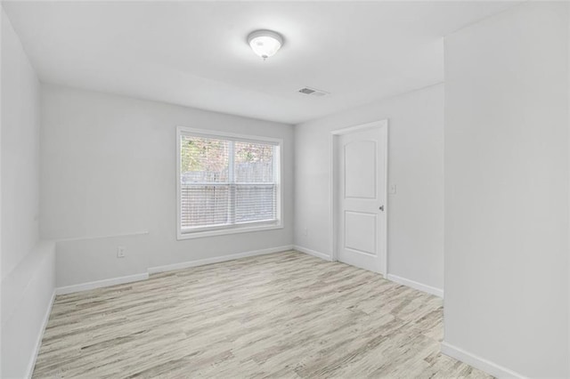 unfurnished room featuring light wood-type flooring