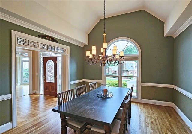 215 Settindown Ct, Roswell, GA 30075 - dining area with wood finished floors, a chandelier, and lofted ceiling