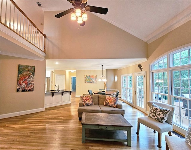 215 Settindown Ct, Roswell, GA 30075 - living area featuring crown molding, high vaulted ceiling, wood finished floors, and a ceiling fan