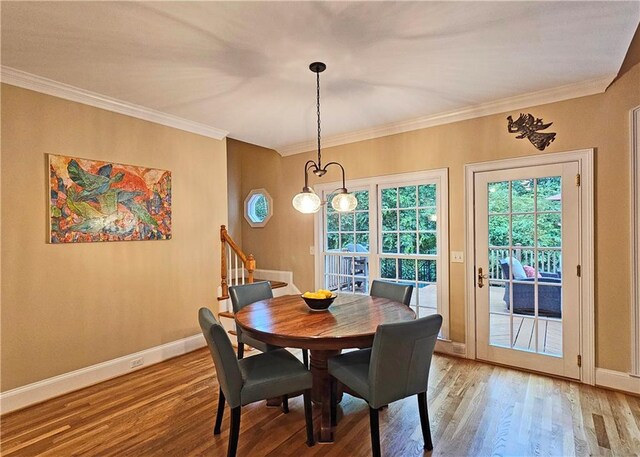 215 Settindown Ct, Roswell, GA 30075 - dining space with light wood-style floors and ornamental molding