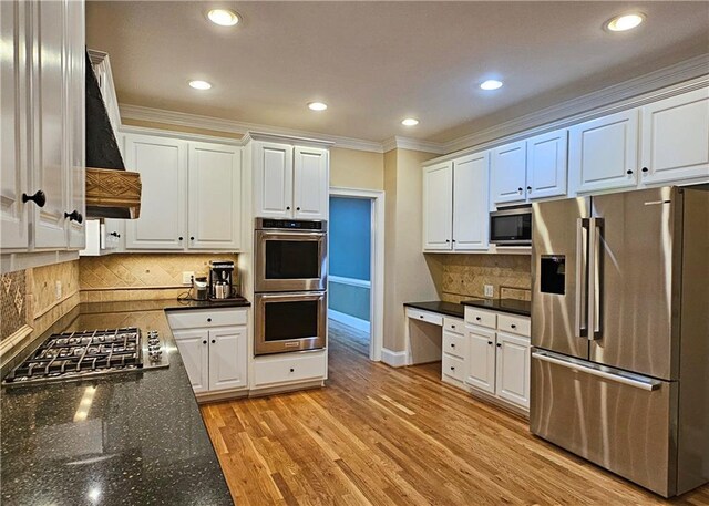 215 Settindown Ct, Roswell, GA 30075 - kitchen featuring appliances with stainless steel finishes, ornamental molding, white cabinetry, recessed lighting, and decorative backsplash