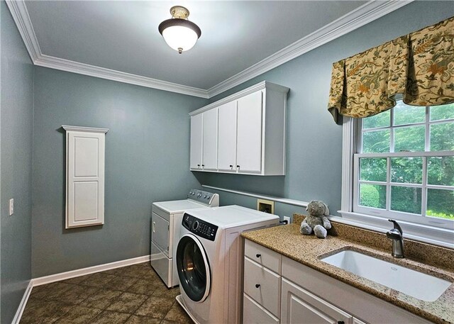 215 Settindown Ct, Roswell, GA 30075 - washroom with independent washer and dryer, cabinet space, ornamental molding, and dark stone finish flooring