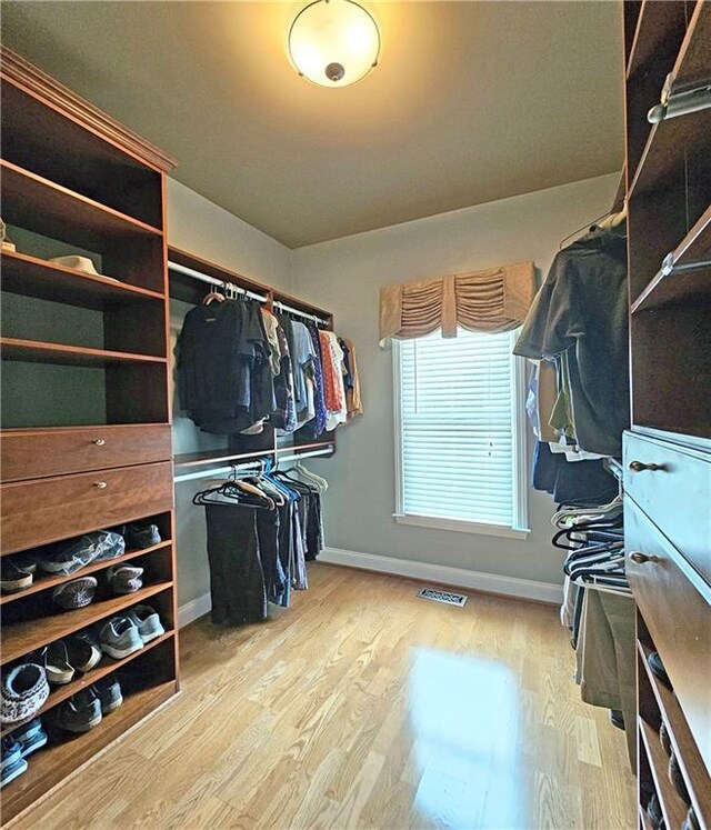 215 Settindown Ct, Roswell, GA 30075 - spacious closet featuring wood finished floors