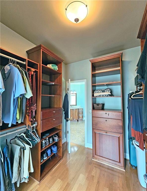 215 Settindown Ct, Roswell, GA 30075 - walk in closet featuring light wood-style flooring
