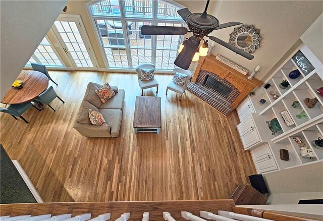 215 Settindown Ct, Roswell, GA 30075 - living area with a ceiling fan, wood finished floors, and a fireplace