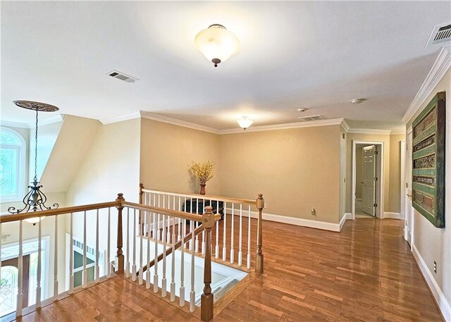 215 Settindown Ct, Roswell, GA 30075 - hallway with an upstairs landing, wood finished floors, and ornamental molding