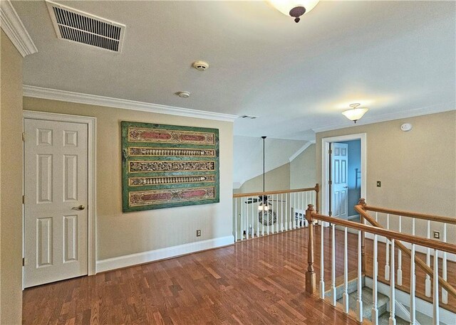 215 Settindown Ct, Roswell, GA 30075 - corridor featuring wood finished floors, ornamental molding, and an upstairs landing