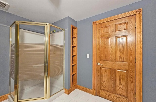 215 Settindown Ct, Roswell, GA 30075 - bathroom featuring a stall shower and tile patterned floors
