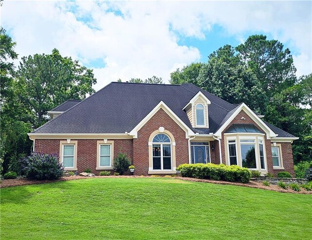 215 Settindown Ct, Roswell, GA 30075 - view of front of house with brick siding and a front yard