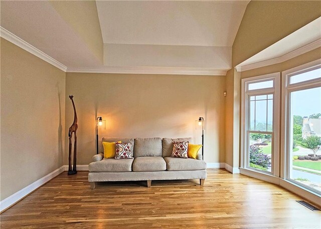 215 Settindown Ct, Roswell, GA 30075 - living area with healthy amount of natural light, wood finished floors, and ornamental molding