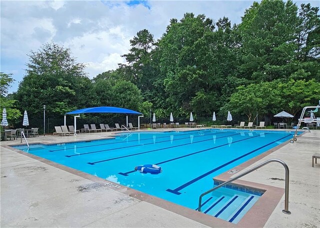 215 Settindown Ct, Roswell, GA 30075 - community pool featuring a patio