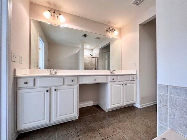 bathroom with vanity, a shower, and tile patterned flooring