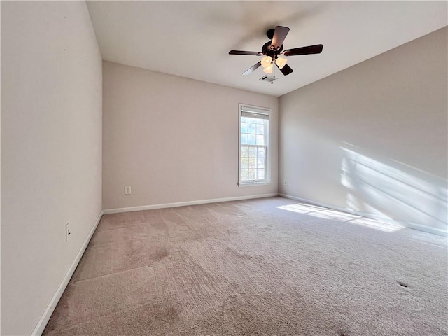 unfurnished room featuring carpet and ceiling fan