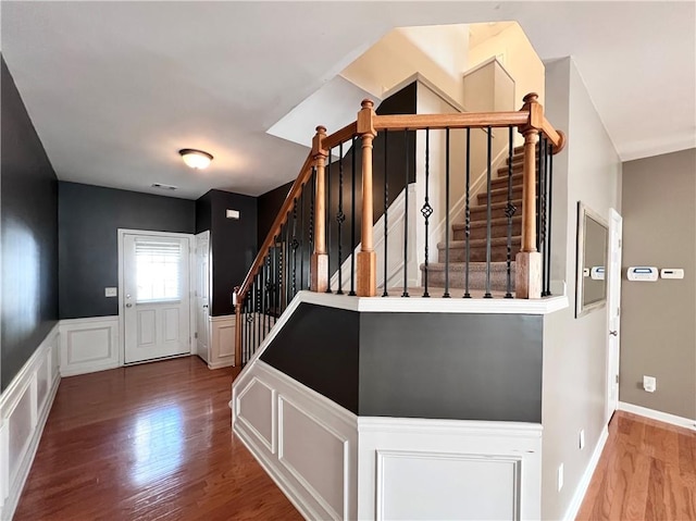 staircase featuring wood-type flooring