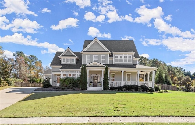 view of front of property with covered porch and a front lawn