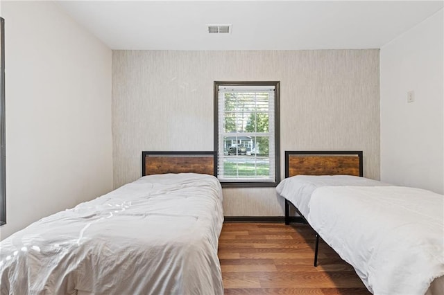 bedroom with wood-type flooring