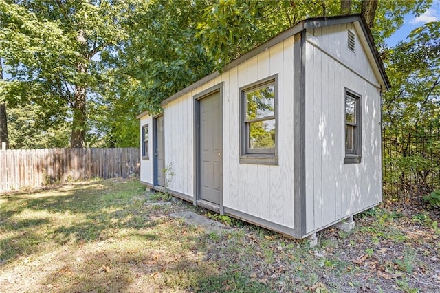 view of outdoor structure with a lawn