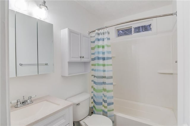 bathroom with shower / bath combination with curtain, vanity, and toilet