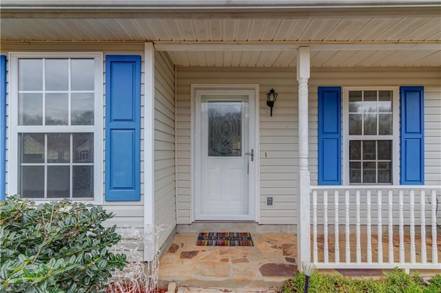 property entrance featuring covered porch